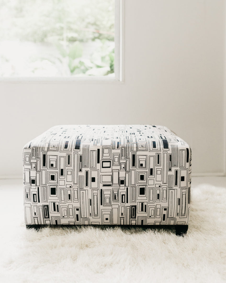 Cristianitos in Clairvoyant Large Ottoman (25" x 27" x 15")